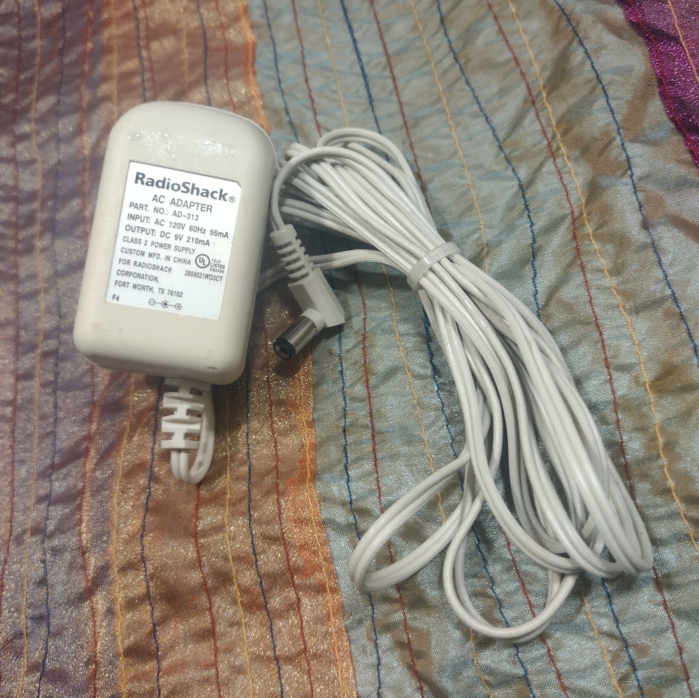 Radio Shack AC adapter Part # AD-313. ( OUTPUT 9v )